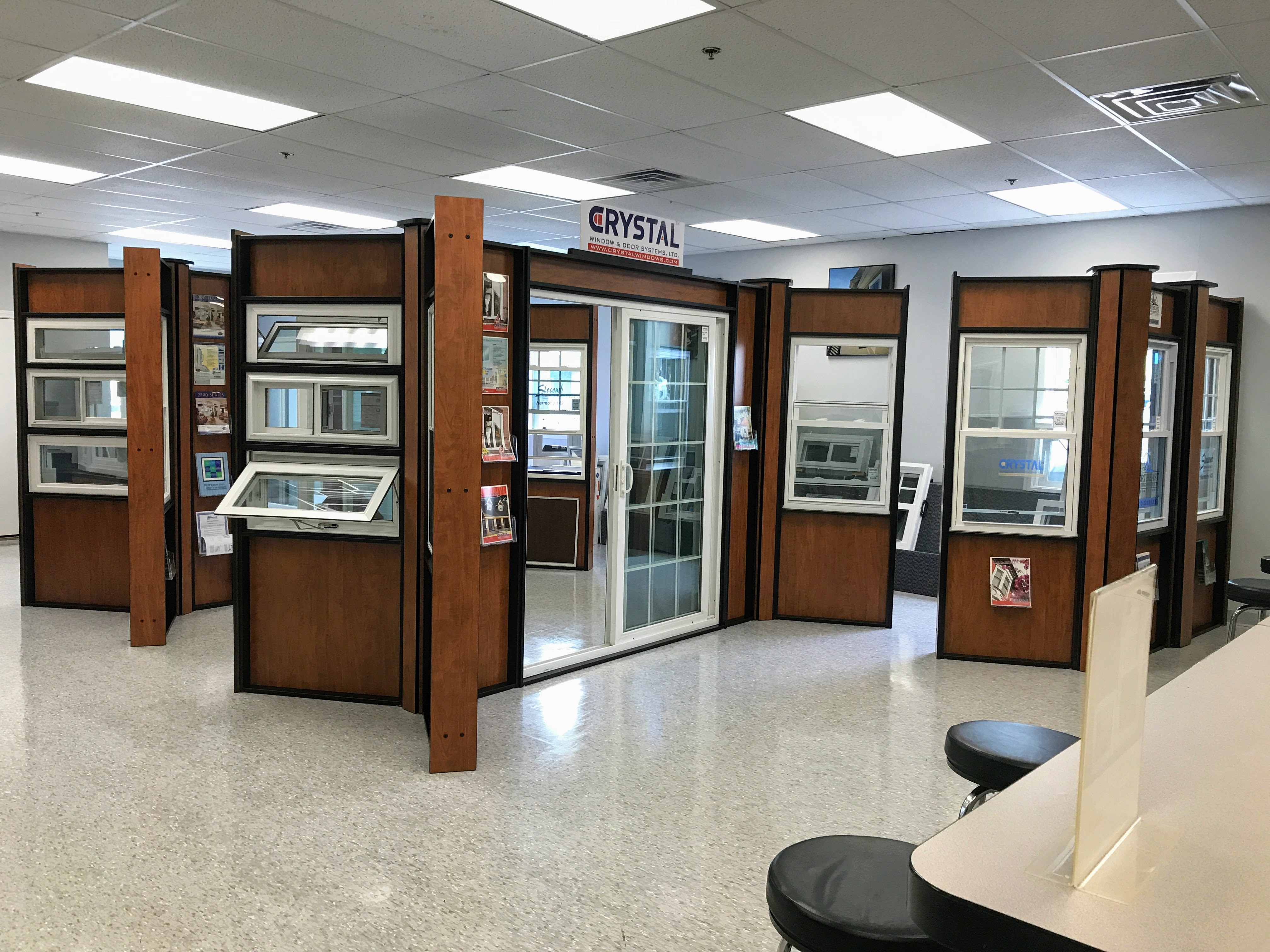 Interior of Venture Window’s 2,500 sq ft Cranston showroom with dozens of windows on display